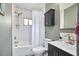Updated bathroom features a shower with white subway tile, a black vanity, and modern fixtures for a clean look at 315 Greenwood Dr, Durham, NC 27704