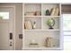Elegant built-in bookcase offering ample storage and display space next to a stylish front door at 315 Greenwood Dr, Durham, NC 27704