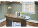 Stylish home office desk with brass lamp and decor at 315 Greenwood Dr, Durham, NC 27704