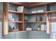 Custom wooden shelves with neutral décor and books at 315 Greenwood Dr, Durham, NC 27704