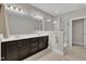 Bathroom featuring double sinks, shower with glass enclosure, and a tiled floor at 318 Acorn Hollow Pl, Durham, NC 27703