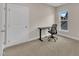 Neutral bedroom with a large window letting in natural light and featuring carpet floors, and a desk with a black chair at 318 Acorn Hollow Pl, Durham, NC 27703