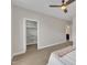 Bedroom with a large closet and view to the ensuite bathroom featuring carpet floors, and neutral paint at 318 Acorn Hollow Pl, Durham, NC 27703