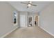 Bright bedroom featuring neutral walls, carpet flooring, and a ceiling fan at 318 Acorn Hollow Pl, Durham, NC 27703