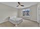 Bedroom with a ceiling fan and a bright window overlooking the neighborhood, and carpeted floors at 318 Acorn Hollow Pl, Durham, NC 27703