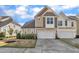 Charming townhome featuring a two-car garage and beautiful architectural details at 318 Acorn Hollow Pl, Durham, NC 27703