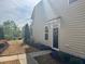 Charming home featuring a black front door adorned with a wreath and colorful landscaping at 318 Acorn Hollow Pl, Durham, NC 27703