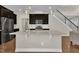 Contemporary kitchen with stainless steel appliances, a large island, and dark wood cabinets at 318 Acorn Hollow Pl, Durham, NC 27703