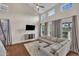 Bright living room featuring high ceilings, modern furniture, and hardwood floors at 318 Acorn Hollow Pl, Durham, NC 27703