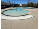Community pool area with zero depth entry for young children, several play features, and lounge chairs at 318 Acorn Hollow Pl, Durham, NC 27703