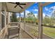 Cozy screened porch with a ceiling fan and a table and chairs; perfect for outdoor relaxation at 318 Acorn Hollow Pl, Durham, NC 27703