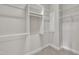 Walk-in closet with built-in shelving and a carpet floor at 318 Acorn Hollow Pl, Durham, NC 27703