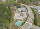 Community amenities include a pool, clubhouse, sports courts, playground, and ample parking near lush greenery at 3262 Ripley River Rd, New Hill, NC 27562