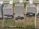 Aerial view of the property showing the backyard, deck, and surrounding neighborhood at 3262 Ripley River Rd, New Hill, NC 27562
