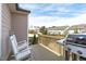 Back deck offers a grill, white chairs, and neighborhood views at 3262 Ripley River Rd, New Hill, NC 27562
