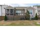 Spacious backyard featuring a deck, patio, and lush green lawn at 3262 Ripley River Rd, New Hill, NC 27562