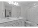 Spacious bathroom with double sink vanity, toilet, and decorative shower curtain at 3262 Ripley River Rd, New Hill, NC 27562