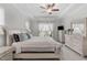 Bright bedroom featuring a large bed, complemented by a light color scheme and natural light from the window at 3262 Ripley River Rd, New Hill, NC 27562