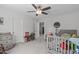 Bedroom with ceiling fan, neutral colored walls, and toys at 3262 Ripley River Rd, New Hill, NC 27562