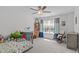Bright bedroom with comfortable bed, light gray walls, ceiling fan, and window with great view outside at 3262 Ripley River Rd, New Hill, NC 27562
