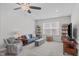 A light gray bonus room featuring a blue sofa and shelving at 3262 Ripley River Rd, New Hill, NC 27562