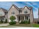 Charming two-story home with a welcoming front porch and well-maintained landscaping at 3262 Ripley River Rd, New Hill, NC 27562