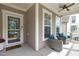 Cozy front porch with comfortable seating, ideal for relaxing and enjoying the outdoors at 3262 Ripley River Rd, New Hill, NC 27562