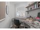 Home office offers built-in shelving and desk with granite countertops at 3262 Ripley River Rd, New Hill, NC 27562