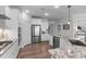 Well-appointed kitchen with stainless steel appliances, granite countertops, and ample cabinet space at 3262 Ripley River Rd, New Hill, NC 27562