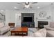Cozy living room featuring a fireplace, TV, and comfortable seating at 3262 Ripley River Rd, New Hill, NC 27562