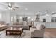 Open-concept living area featuring kitchen, dining, and living spaces with modern furnishings at 3262 Ripley River Rd, New Hill, NC 27562