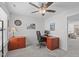 Bright office with ceiling fan, light gray walls, dark wood desk, and decor at 3262 Ripley River Rd, New Hill, NC 27562