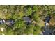 Aerial view of home and neighborhood surrounded by mature trees at 3417 Windmere Dr, Sanford, NC 27330