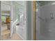 Contemporary bathroom showing the tub, shower, and entry to another room at 3417 Windmere Dr, Sanford, NC 27330