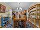 Dining room showcasing hardwood floors, wood table set, and open to the kitchen at 3417 Windmere Dr, Sanford, NC 27330