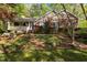 Charming brick home featuring a quaint front porch and beautifully landscaped yard at 3417 Windmere Dr, Sanford, NC 27330