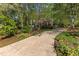 Home exterior featuring a long driveway and natural, wooded surroundings at 3417 Windmere Dr, Sanford, NC 27330