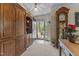 Inviting foyer featuring a wooden cabinet and view of the front door at 3417 Windmere Dr, Sanford, NC 27330