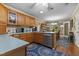 Bright kitchen featuring wood cabinetry, stainless steel appliances, and an eat-in area at 3417 Windmere Dr, Sanford, NC 27330