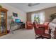 Inviting office space features a vintage desk, computer, and comfortable chairs, perfect for remote work at 3417 Windmere Dr, Sanford, NC 27330