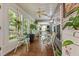 Inviting sunroom featuring comfortable chairs, multiple windows, and hardwood floors at 3417 Windmere Dr, Sanford, NC 27330