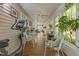 Extended sunroom space with exercise equipment, wood floors, and lovely natural light at 3417 Windmere Dr, Sanford, NC 27330