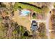 Expansive backyard with inground pool and lush landscaping provides privacy and space to relax at 3908 Yateswood Ct, Raleigh, NC 27603