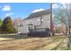 Large two-story home exterior featuring a deck, chimney and spacious yard at 3908 Yateswood Ct, Raleigh, NC 27603