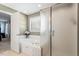 This bathroom showcases a bathtub, frosted-glass shower, and white tile at 3908 Yateswood Ct, Raleigh, NC 27603