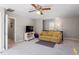 Upstairs bonus room featuring carpet, a ceiling fan, and comfortable seating at 3908 Yateswood Ct, Raleigh, NC 27603