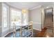 Bright breakfast nook with large windows and stylish seating at 3908 Yateswood Ct, Raleigh, NC 27603