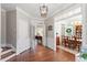 Elegant home entryway with gleaming hardwood floors and detailed trim work at 3908 Yateswood Ct, Raleigh, NC 27603