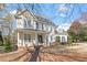 Beautiful two-story home with a charming front porch and well-maintained landscaping at 3908 Yateswood Ct, Raleigh, NC 27603