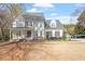 Beautiful two-story home with a charming front porch and well-maintained landscaping at 3908 Yateswood Ct, Raleigh, NC 27603